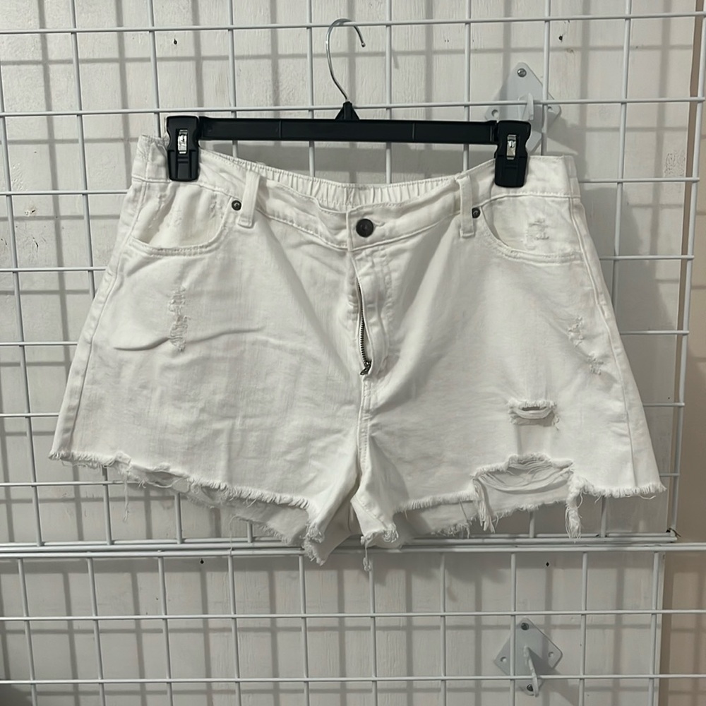 Distressed white denim shorts
